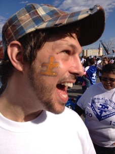 Nick with an Autism Awareness puzzle piece painted on.