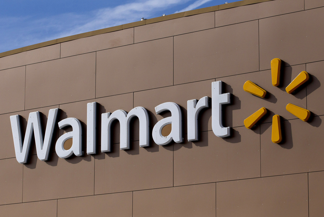 Picture of Walmart logo on the front of one of their buildings.